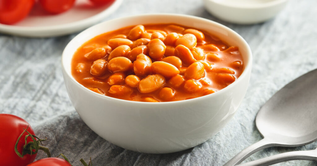 Bowl of cooked beans in tomato sauce
