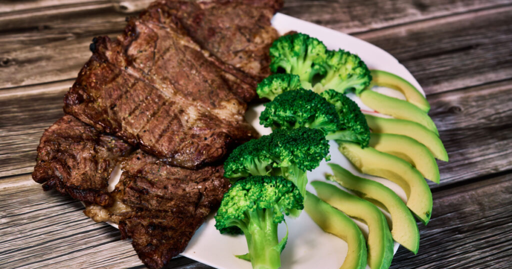 Keto diet based on beef steak, broccoli and avocado. High quality photo
