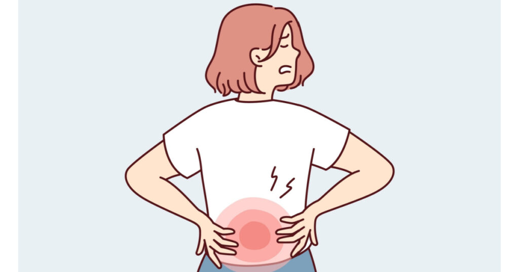 Woman stands with back to screen and holds on to red lower back after failing to lift heavy bag. Girl suffers from pain in spine needs massage or help of osteopath doctor. Flat vector illustration

