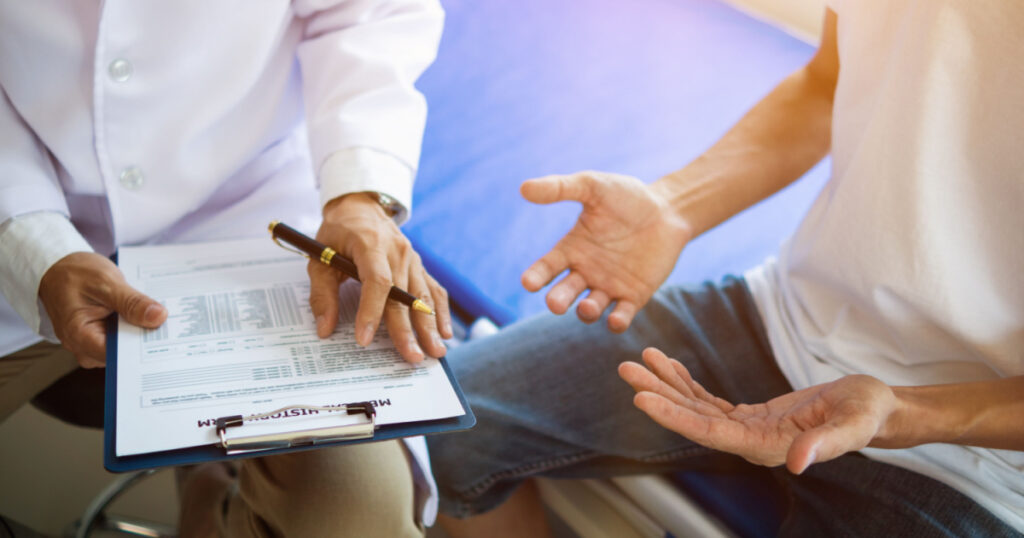 doctor is having consultation discussing prostate cancer and venereal cancer detected in young man. Current doctors provide advice and counseling on detecting prostate cancer and treating it properly.
