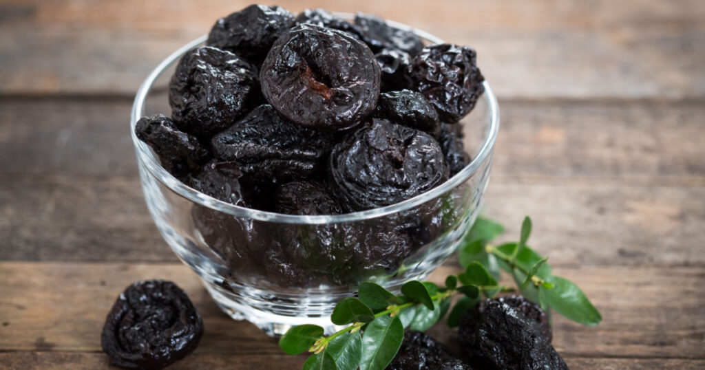 Dried plums - prunes in the bowl
