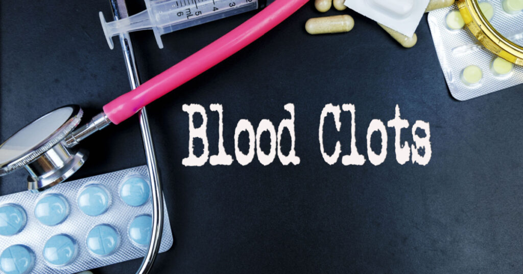 Blood Clots word, medical term word with medical concepts in blackboard and medical equipment background.
