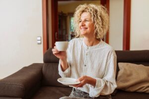 woman drinking a cup of coffee or tea