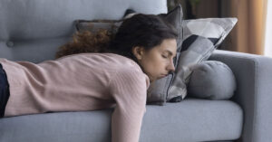 woman napping on couch