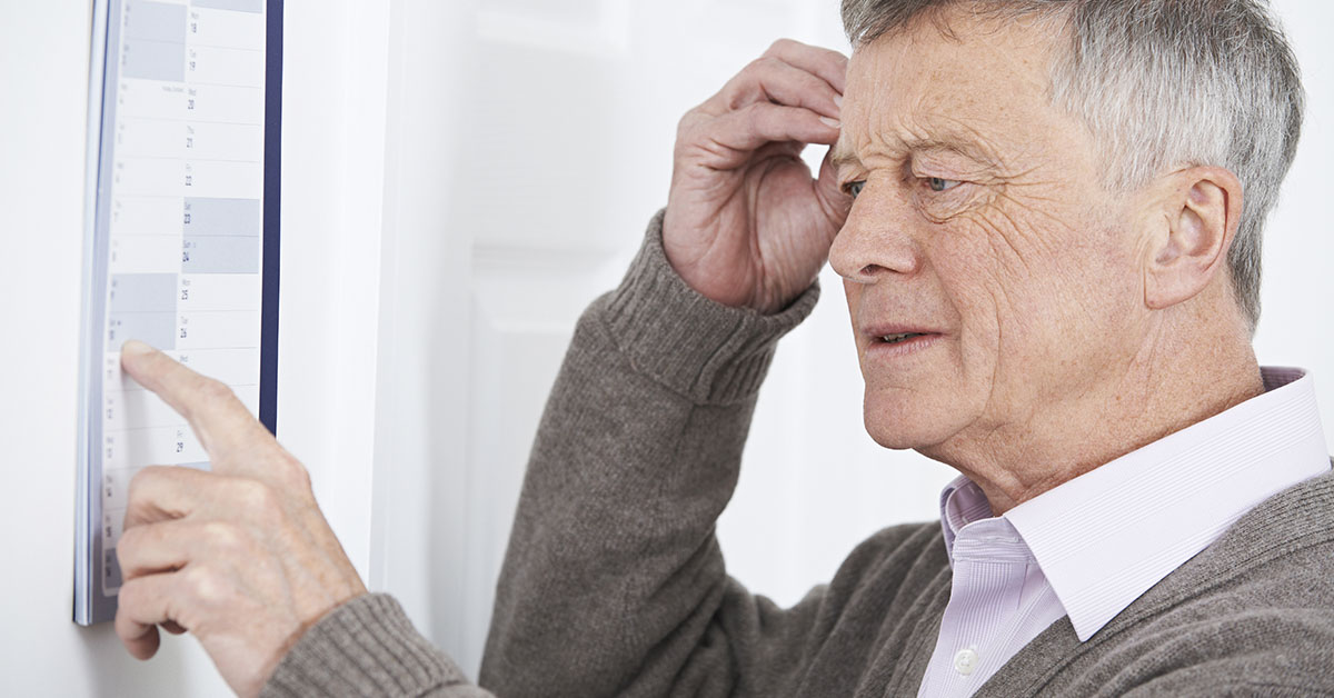 confused elderly man scratching head. dementia concept