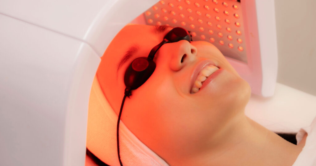 Led phototherapy for the face. LED lamp for photodynamic therapy. Face care. Light therapy at home.