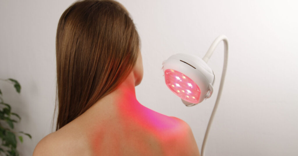 Girl using Light therapy device