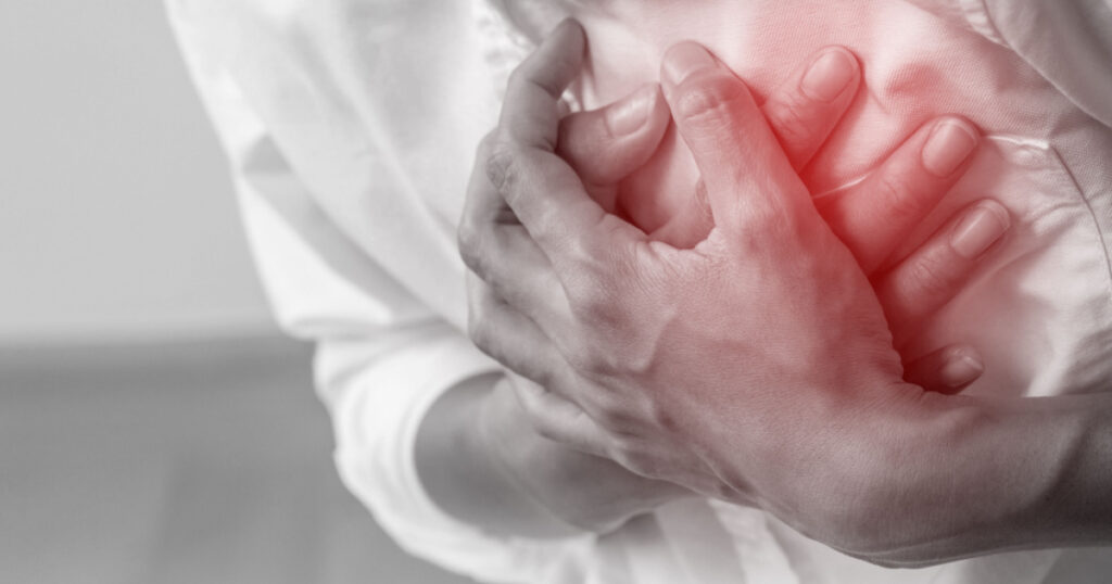 Man clutching his chest from acute pain.Heart attack symptom-Healthcare and medical concept.