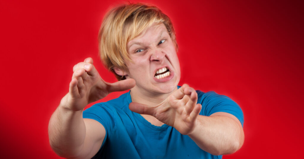 Man reaching to hurt someone unlucky on red background