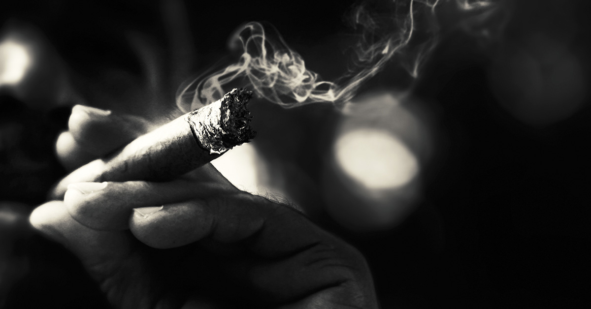 black and white image, close up of lit cigarette