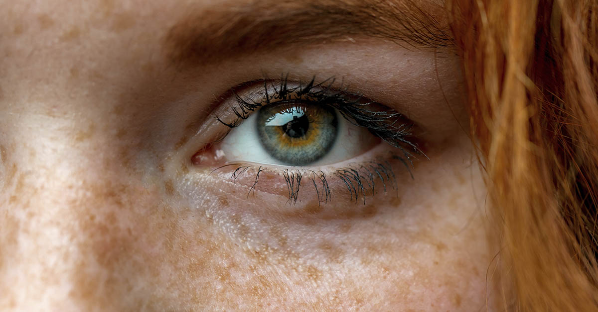 Close up of eye of Redheaded woman with green eyes