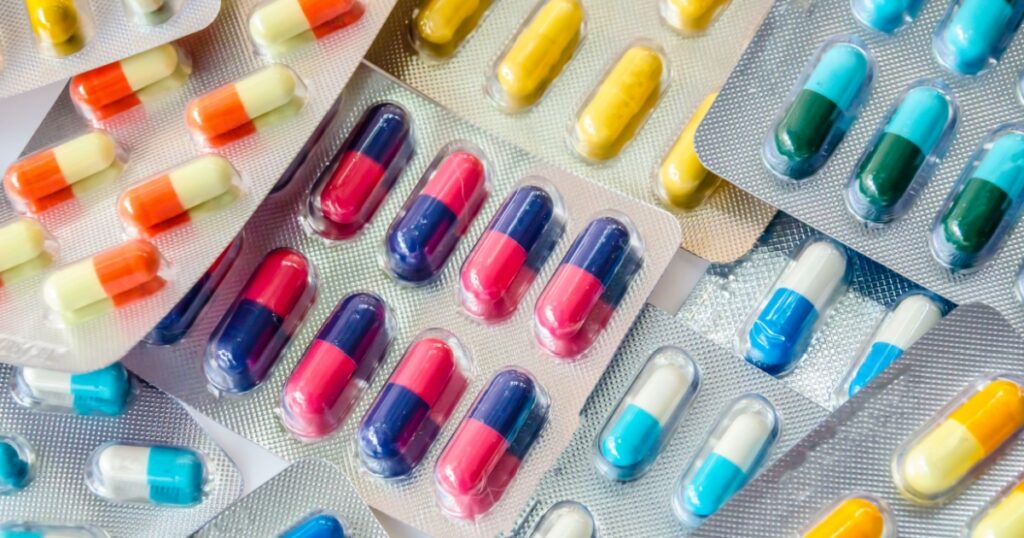 pharmaceuticals antibiotics pills medicine /colorful antibacterials pills on white background /capsule pill medicine