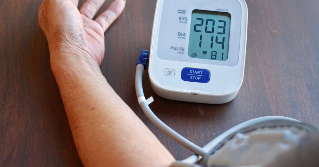 Elderly Man check blood pressure and heart rate at home with digital pressure very high blood pressure test results.Risk for cardiology.Need some medicine.Health and Medical concept.