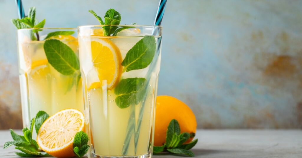 Two glass with lemonade or mojito cocktail. With copy space.
