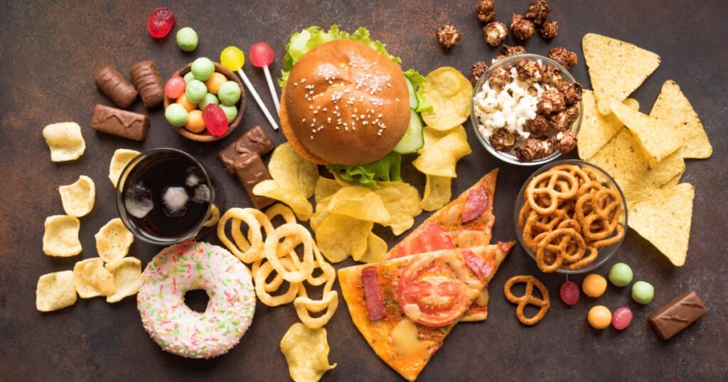 Assortment of Unhealthy Food, top view, copy space. Unhealthy eating, junk food concept.