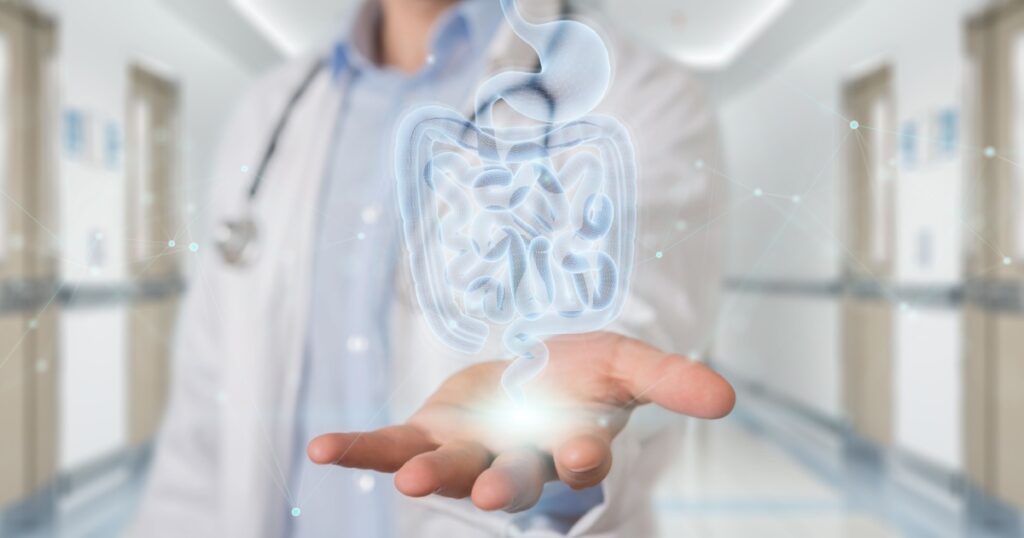 Gastroenterologist on blurred background using digital x-ray of human intestine holographic scan projection 3D rendering