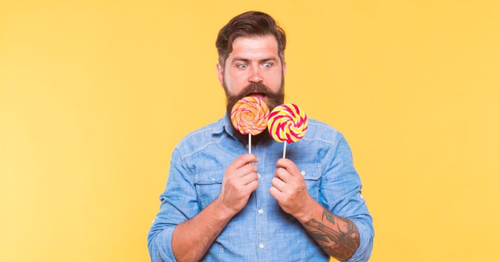 Dont let hunger happen to you. Surprised hipster look at lollipops. Enjoying candy snack. Unhealthy food and snacking. Diet and dieting. Sweet snack. Dessert. Candy shop. Double your pleasure.
