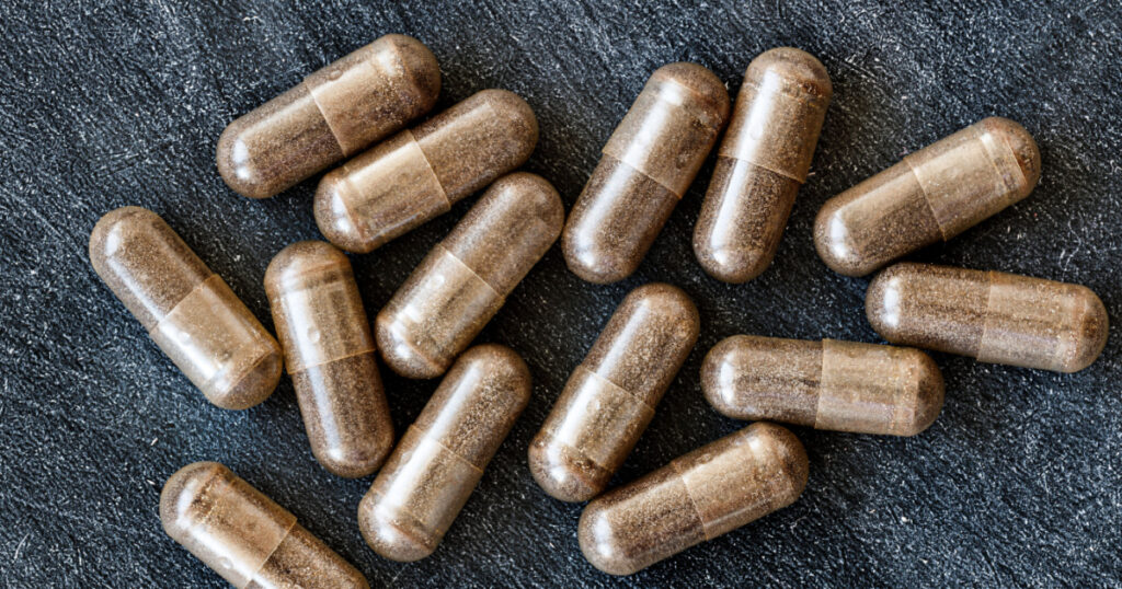 close-up of licorice (DGL) capsules. dietary concept. dietary supplement topview.