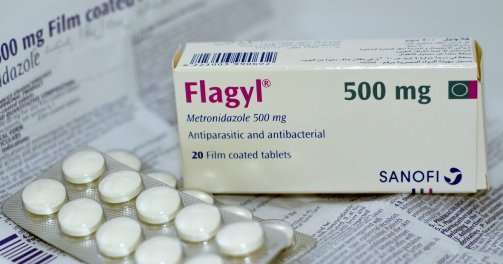 Cairo, Egypt, May 4 2023: Flagyl metronidazole 500mg tablets, Amebicides, an antibiotic that is used to treat bacterial infections of the vagina, stomach, liver, skin, joints, brain and spinal cord