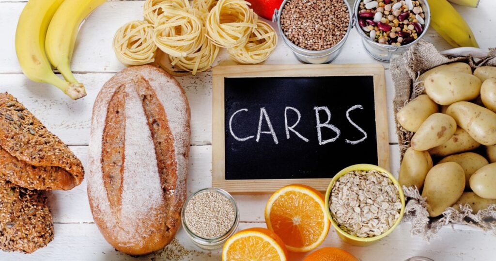 Best Sources of Carbs on a white wooden background. Top view