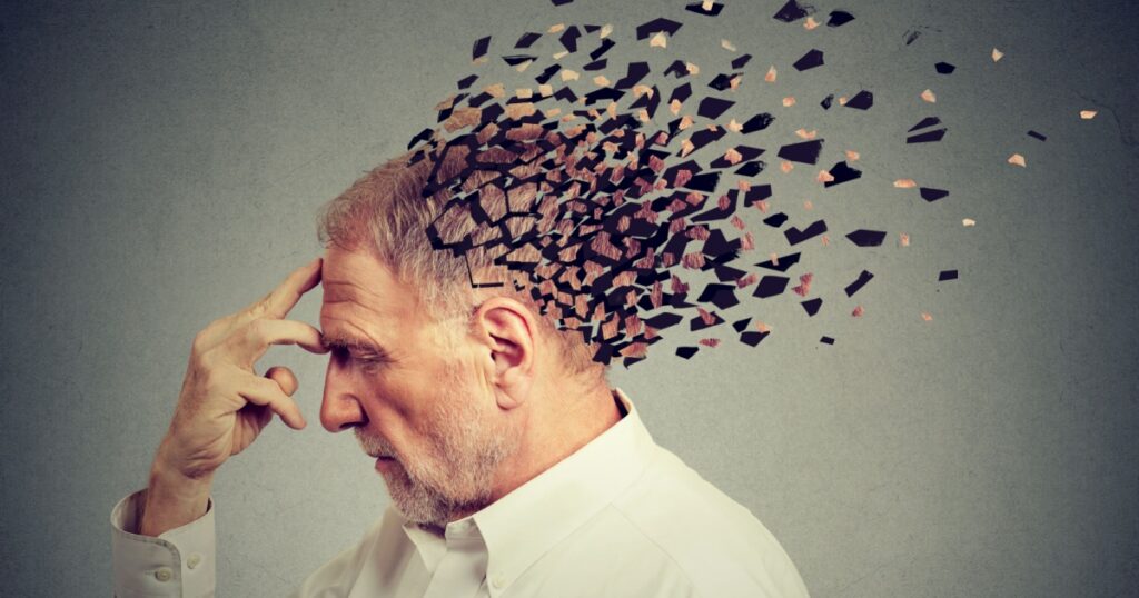 Memory loss due to dementia. Senior man losing parts of head as symbol of decreased mind function.