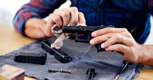 mean cleaning hand gun. Gun safety concept