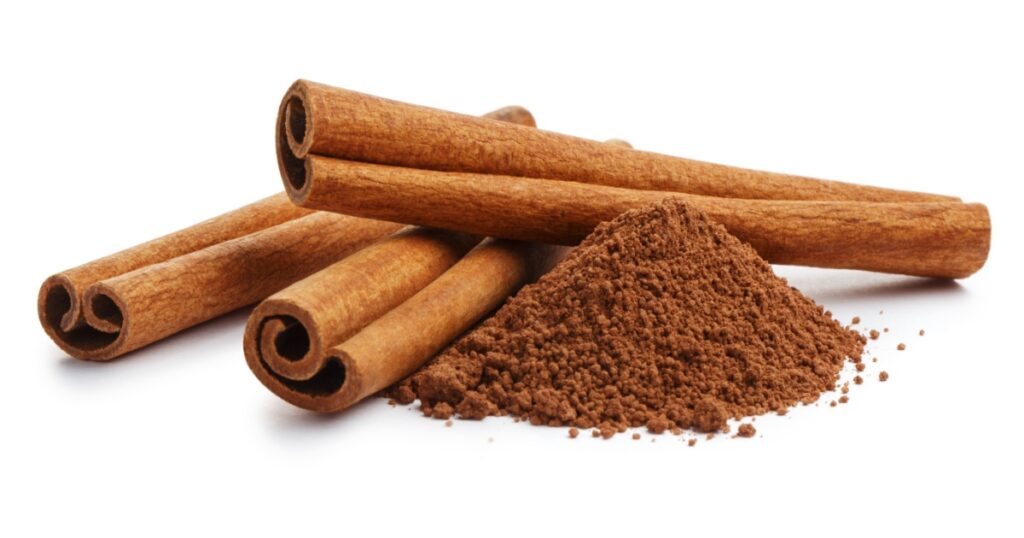 Cinnamon sticks and powder, isolated on white background