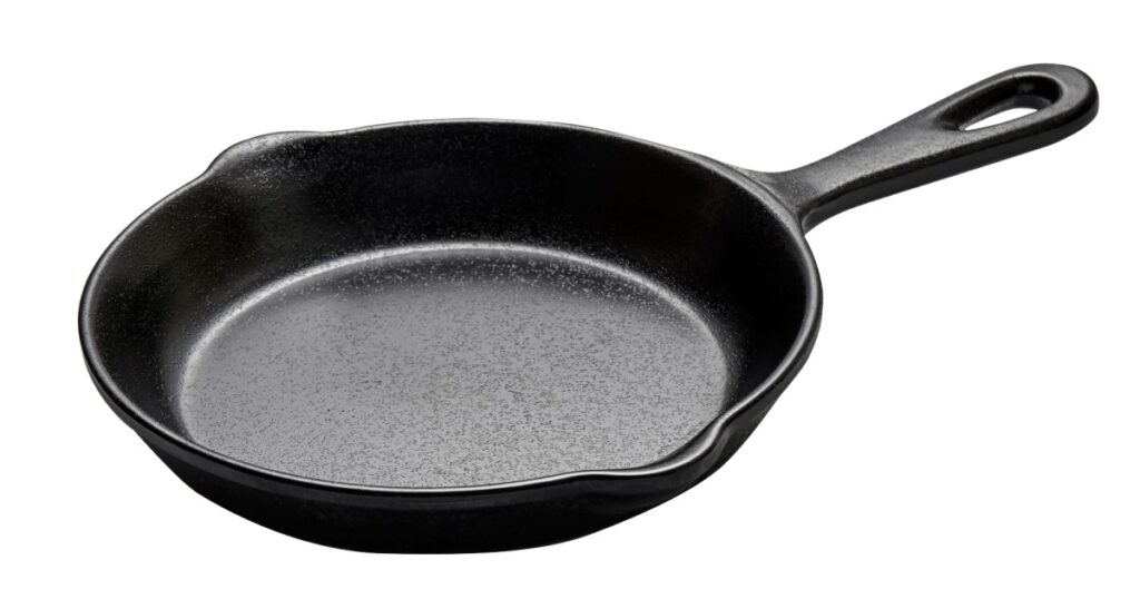 Cast iron skillet, Empty cast iron pan with handled isolated on white background with clipping path, Side view