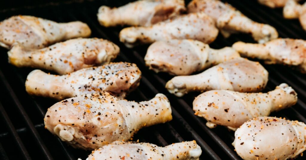 Raw Seasoned Chicken Drumsticks On The Grill, Grilling Chicken