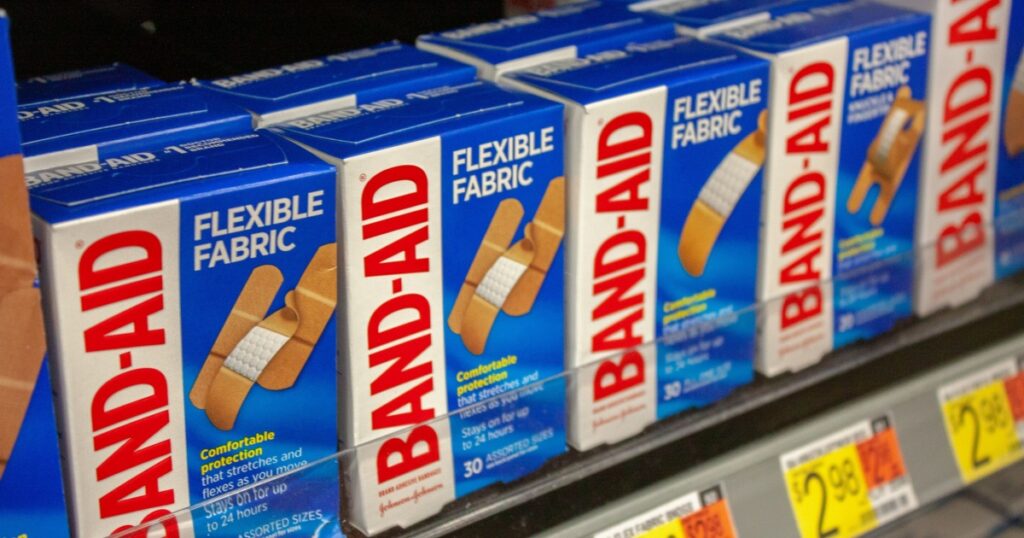 Albuquerque, New Mexico / USA - November 2 2020: Boxes of Band-Aids in Walmart in the pharmacy and over-the-counter medication aisle