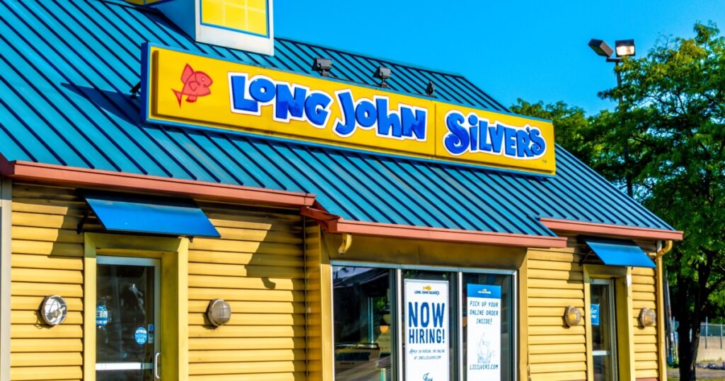 Detroit, MI USA - September 2, 2021: Horizontal, medium shot of "Long John Silvers" fast seafood restaurant's exterior, rooftop, facade brand signage on a bright sunny day.