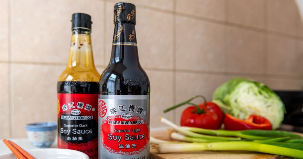London. UK- 05.14.2023. A bottle of light and dark Pearl River Bridge soy sauce on a kitchen worktop.