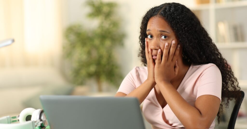 Concerned black student e-learning looking at you complaining at home