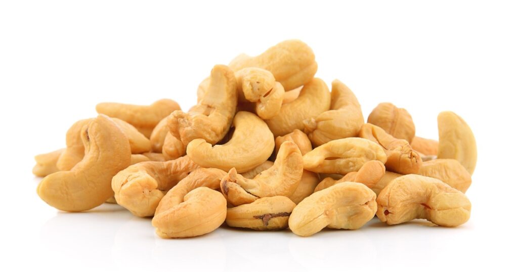 cashew nuts heap on white