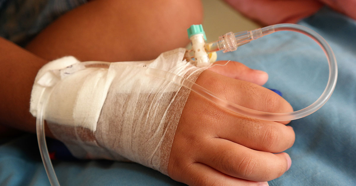 hand of young child with IV in place