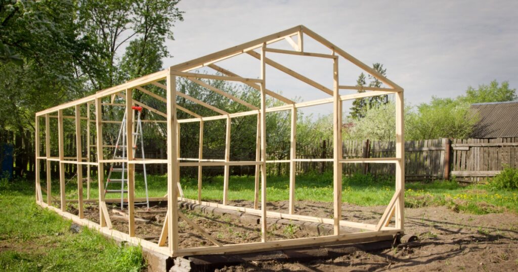 Construction of a small greenhouse in a garden