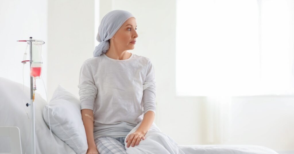 Mature woman after chemotherapy in clinic