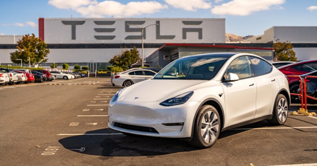 Fremont, CA, USA - October 21, 2023: White Tesla in front of the factory.
