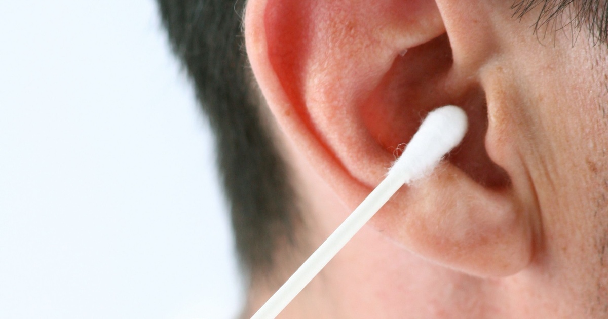 q tip being used to clean ear