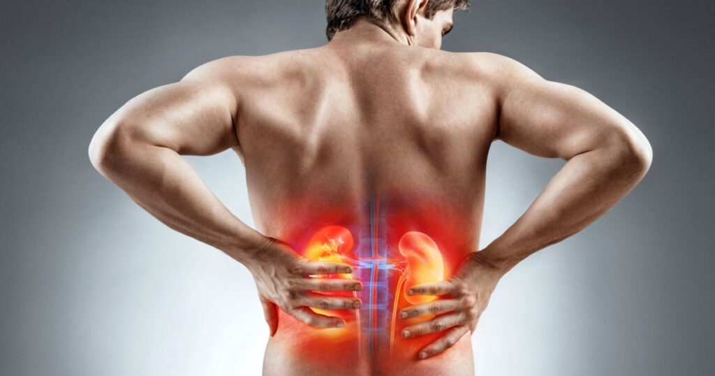 Kidneys pain. Man holding his back. Medical concept.