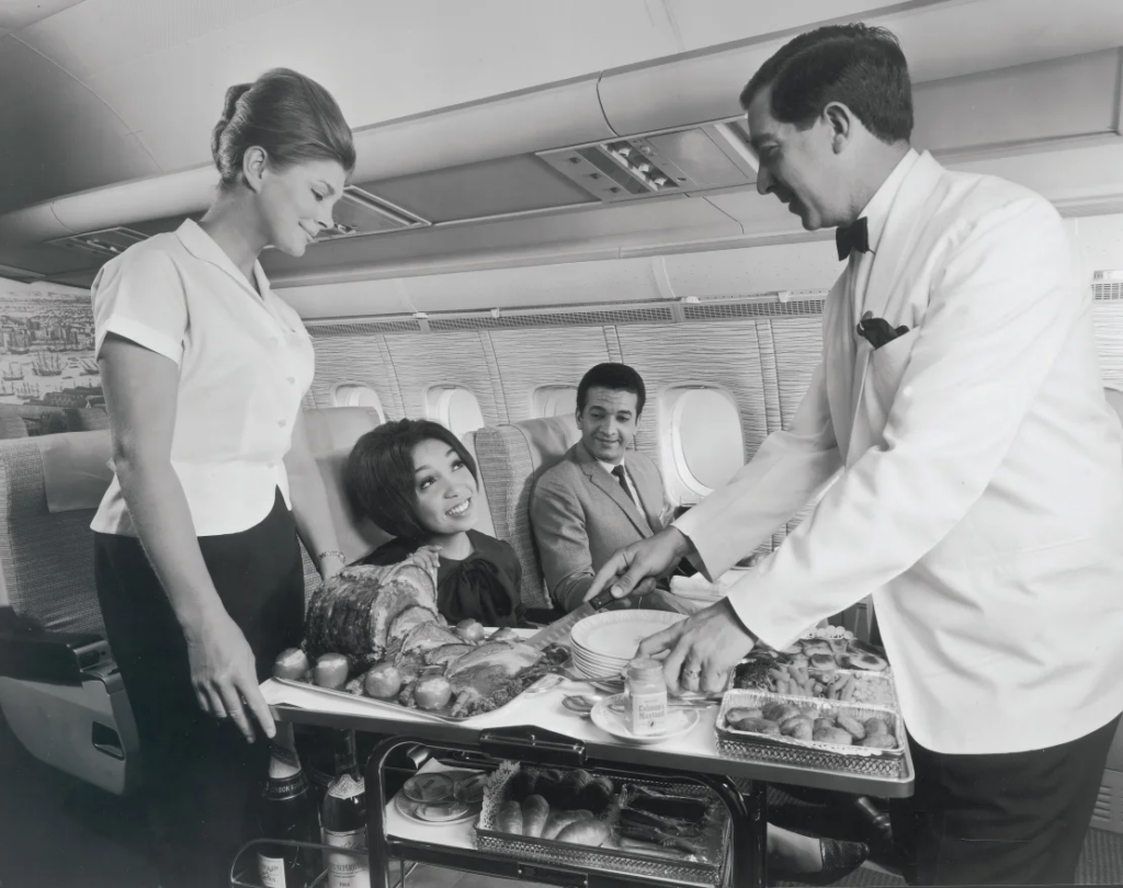 golden age of flying - Sunday roast is carved for passengers in first class on a BOAC VC10 in 1964