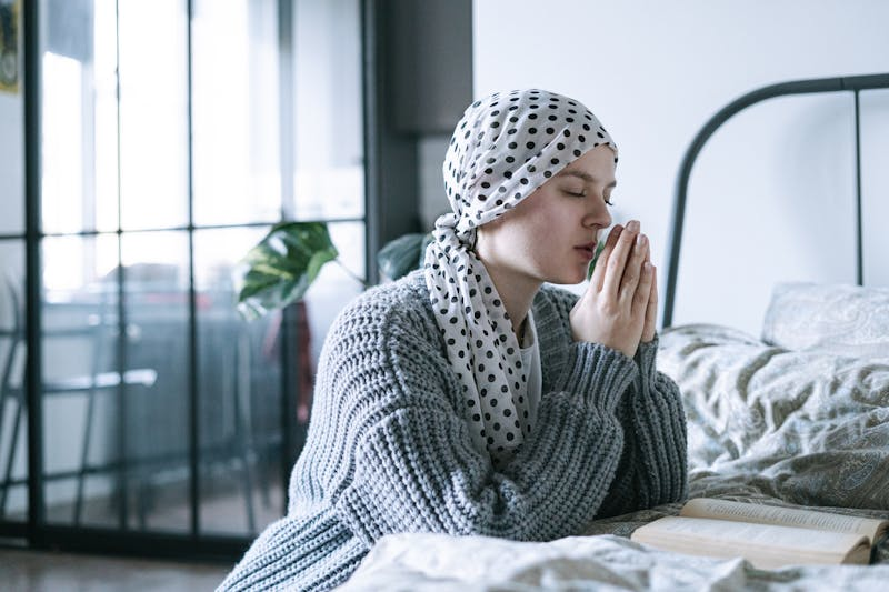 Cancer patient praying