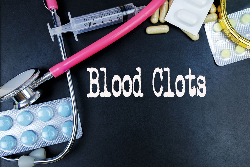 Blood Clots word, medical term word with medical concepts in blackboard and medical equipment background.