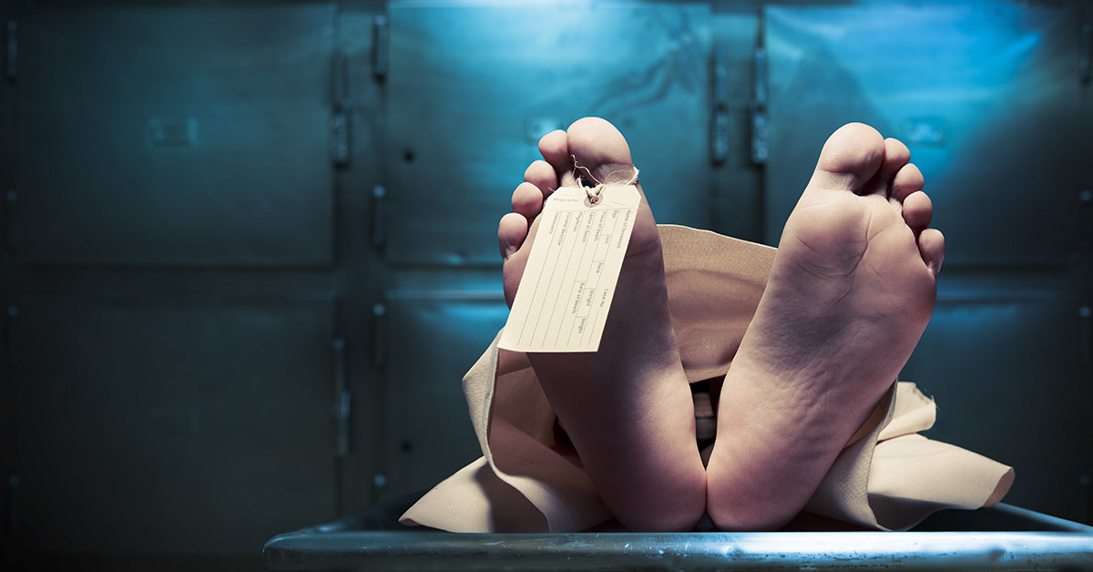tag on toe of body in morgue setting