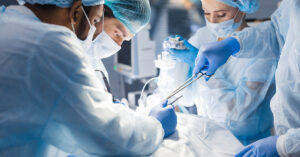 various medical professionals performing surgery