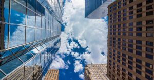 tall skyscrapers seen from below looking up at sky