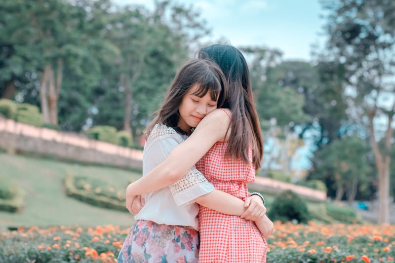 Two girls hugging