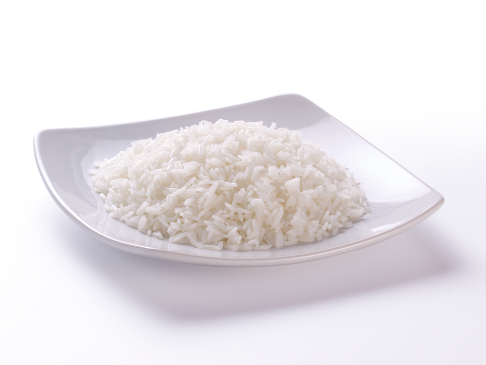 cooked rice on plate and white background
