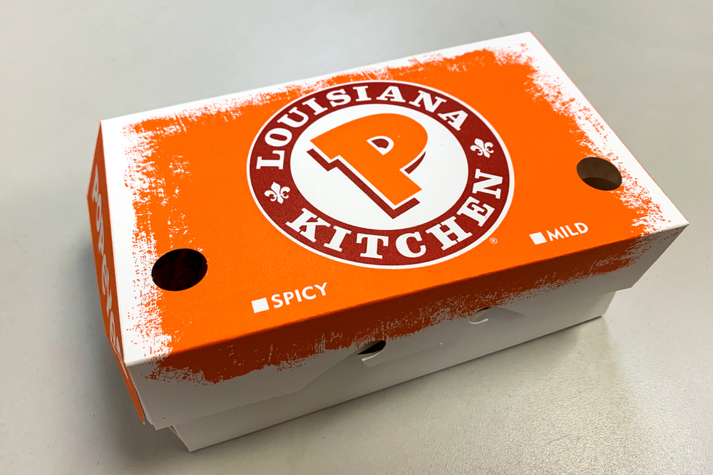 Popeyes logo on a box of chicken tenders. Manhattan, New York, USA September 4, 2018.