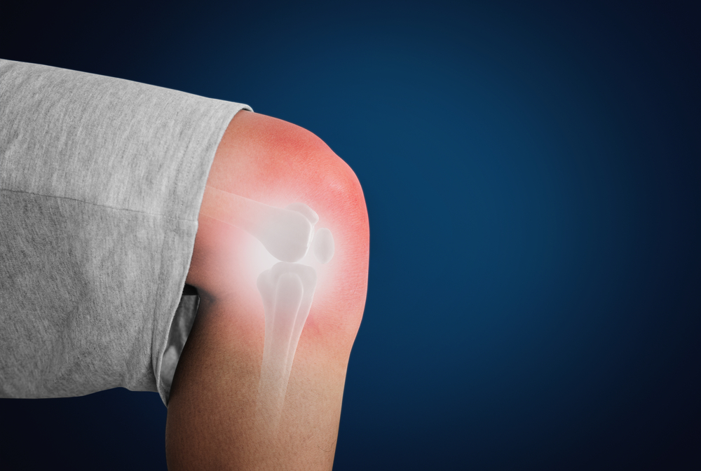 Knee with red highlights concept of knee, joint and bone pain